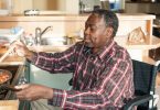 man in wheelchair cooking