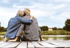retired couple sitting on dock