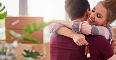 man and woman hugging