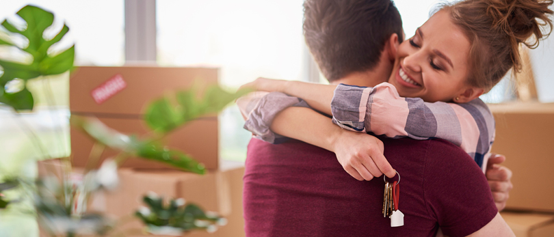 man and woman hugging