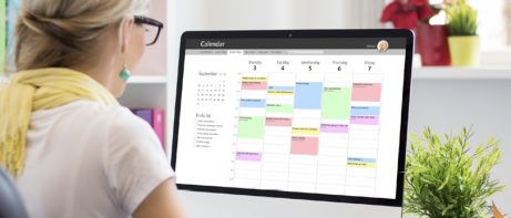 woman looking at digital planner