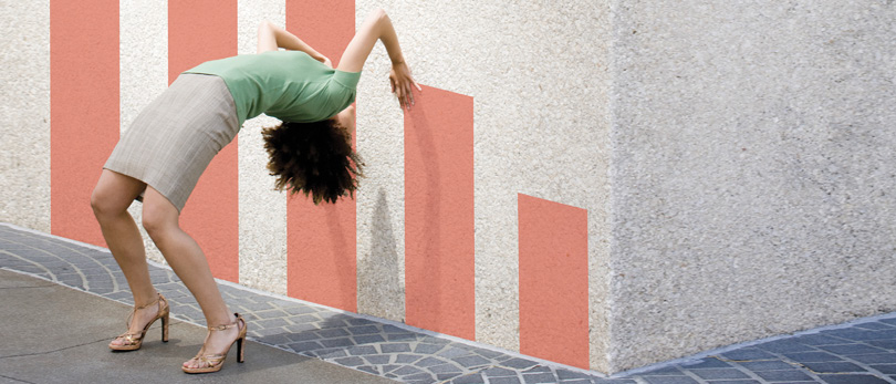 woman bending over against wall graph