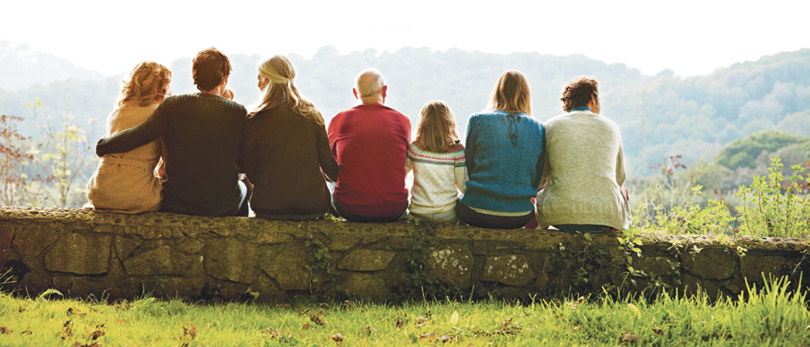 multiple aged family members sitting together