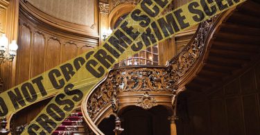 ornate staircase with crime scene tape