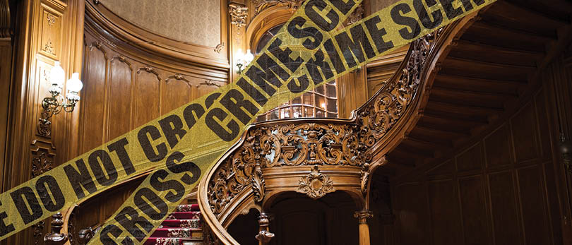 ornate staircase with crime scene tape