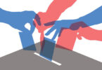 placing ballots in a box