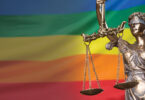 pride flag with scales of justice