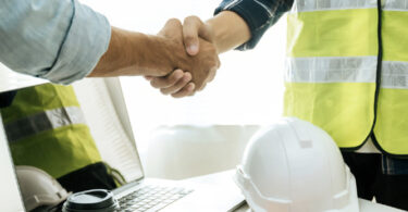 builder shaking hand with person