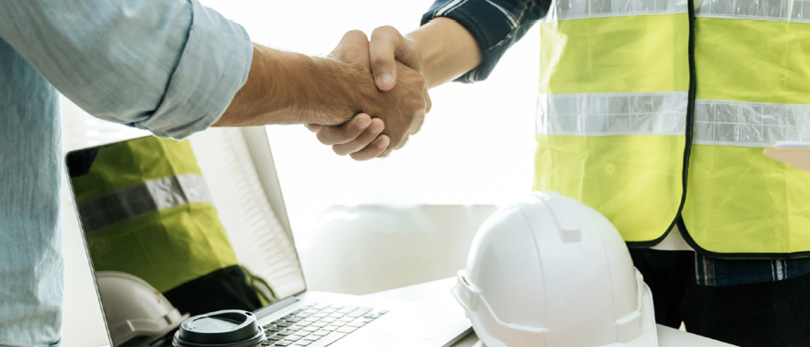 builder shaking hand with person