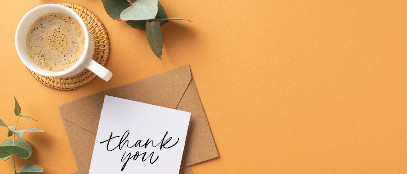 handwritten note on desk with coffee