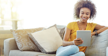 woman looking at content on tablet