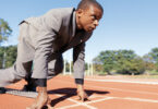 Man in suit ready to run race
