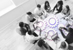 people sitting around a cog-based table