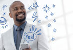 man with illustrated symbols and a yes surrounding him
