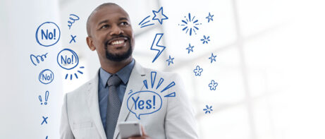 man with illustrated symbols and a yes surrounding him