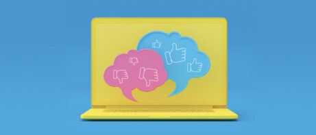 laptop with positive and negative idea bubbles