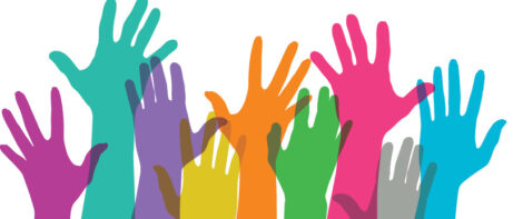 colorful hands raised