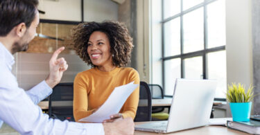 man and woman discussing business