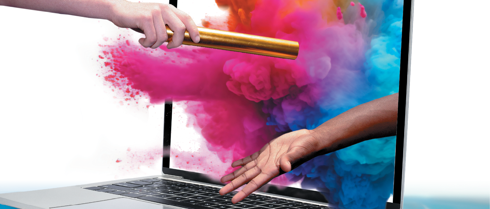 hands passing baton through computer with colorful dust