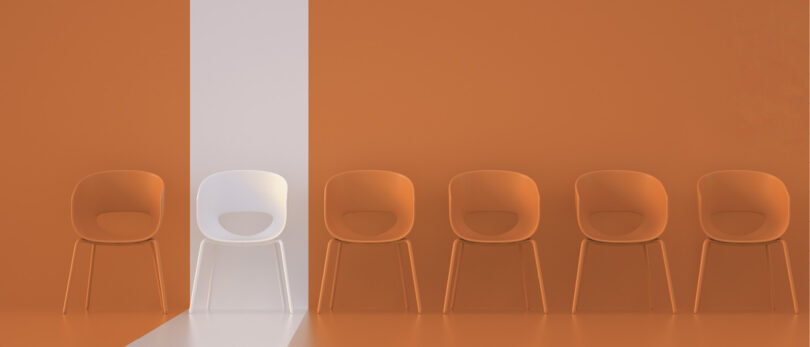 chairs with orange background with one highlighted white