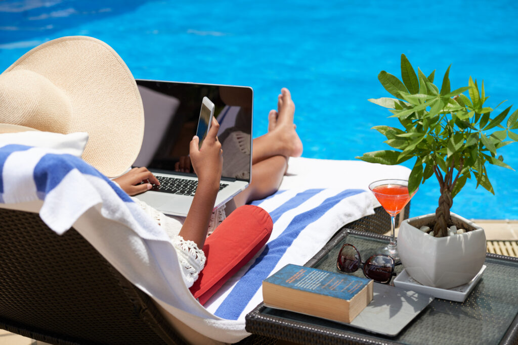Professional checking messages during a planned vacation check-in