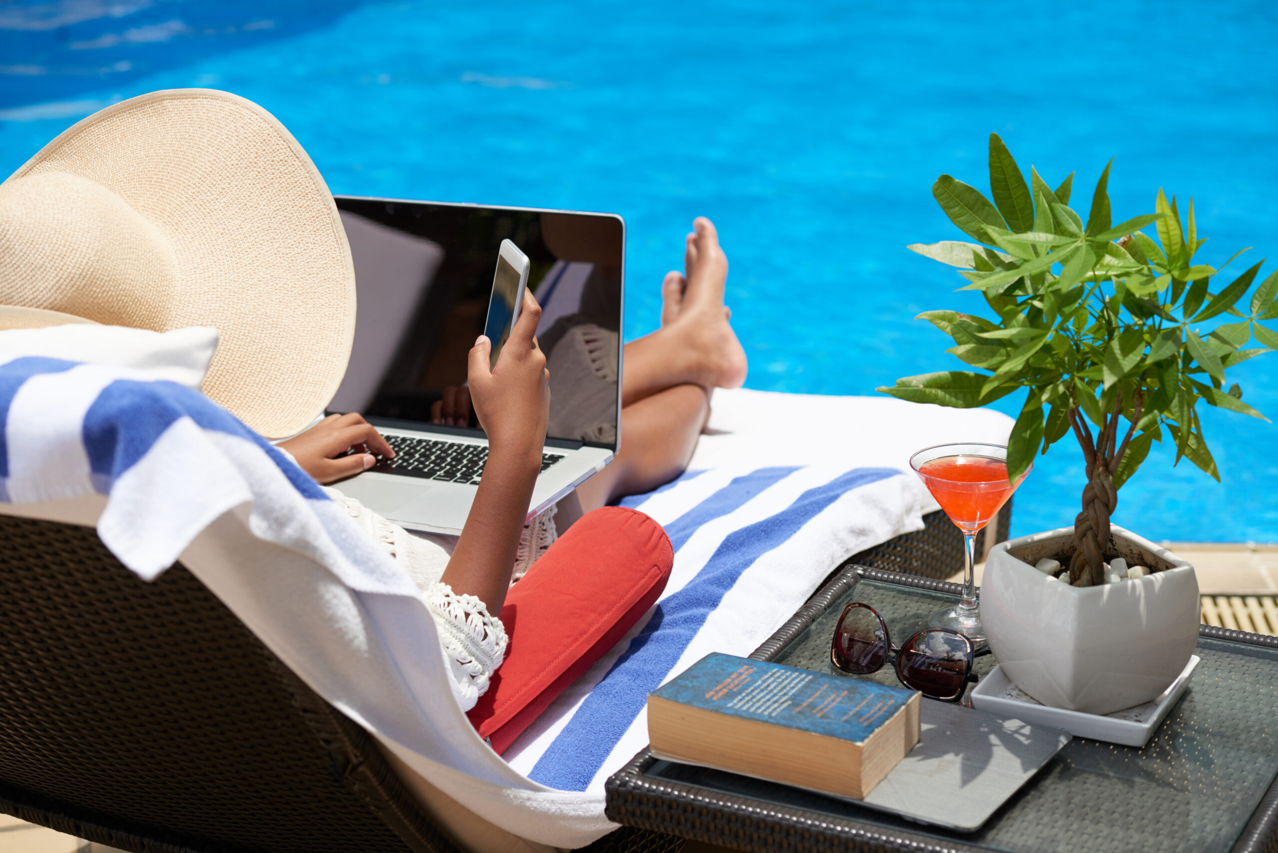 Professional checking messages during a planned vacation check-in